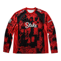 Front of a red and black Astralis long-sleeve jersey with Stake branding