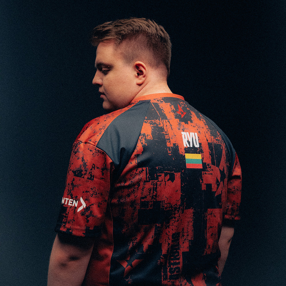 RYU wearing a red and black patterned Astralis jersey against a dark background